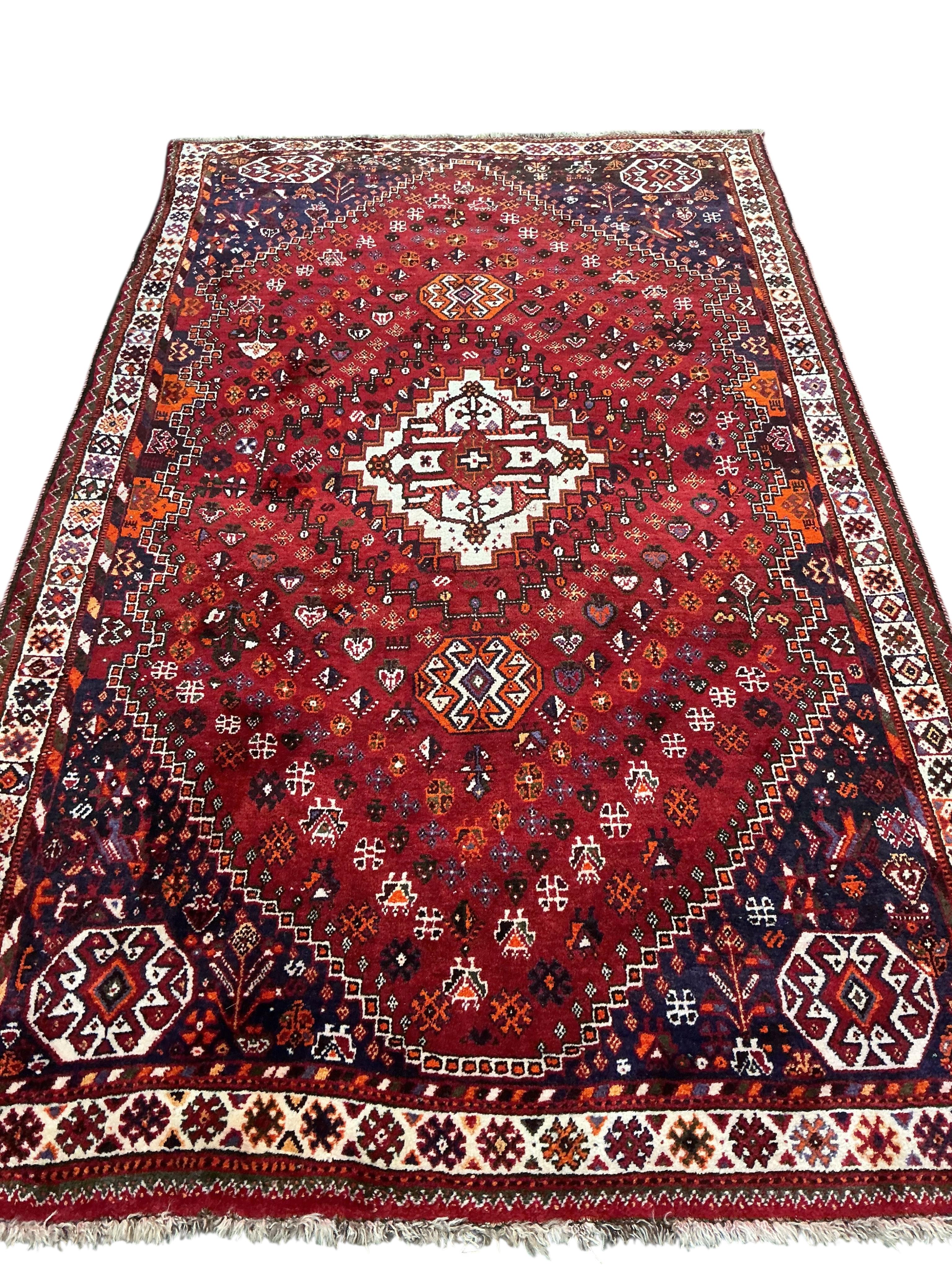 A Hamadan red ground rug 255 x 162cm